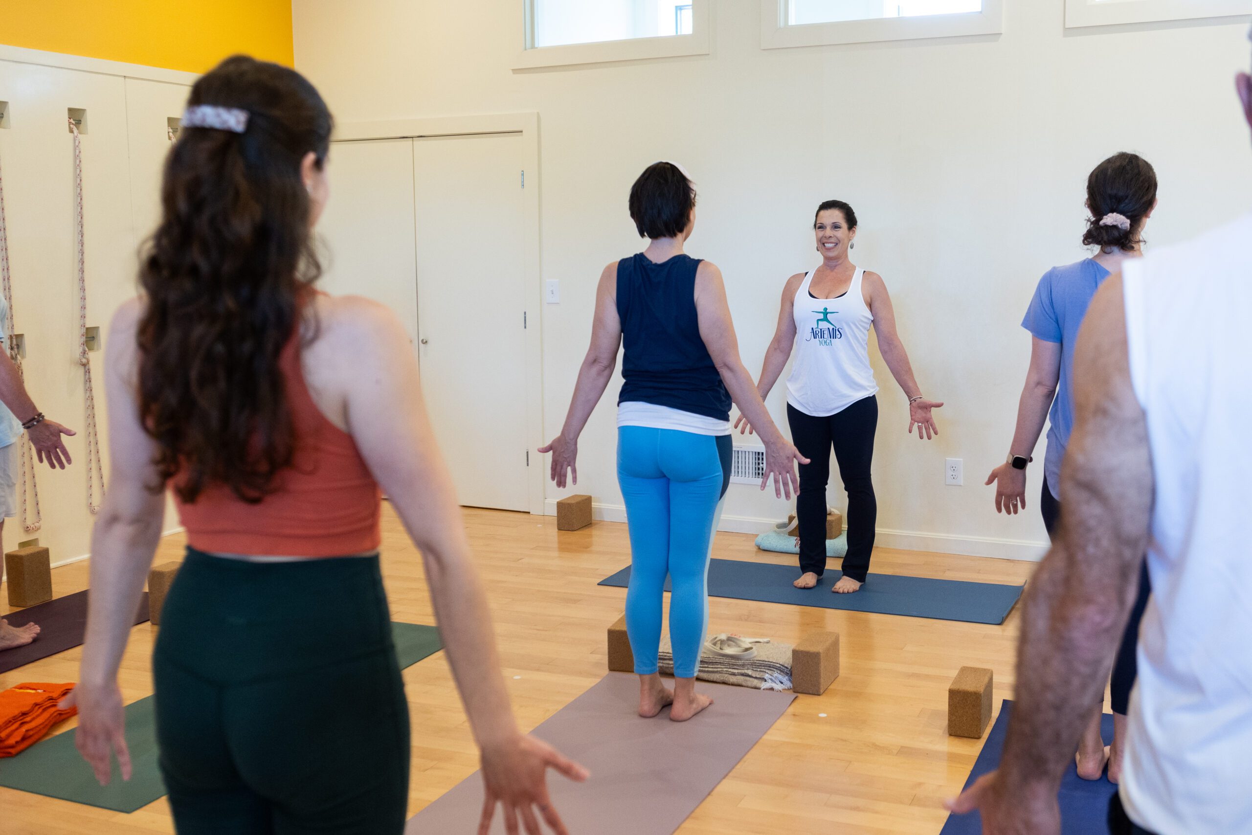 yoga class in mountain pose